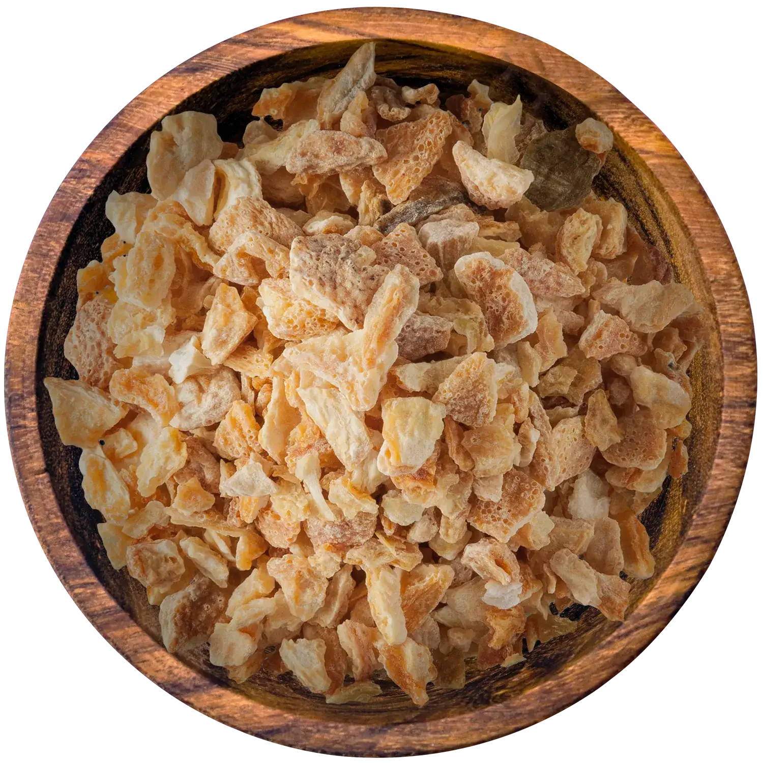 Zitronenschalenstücke in einer Holzschale